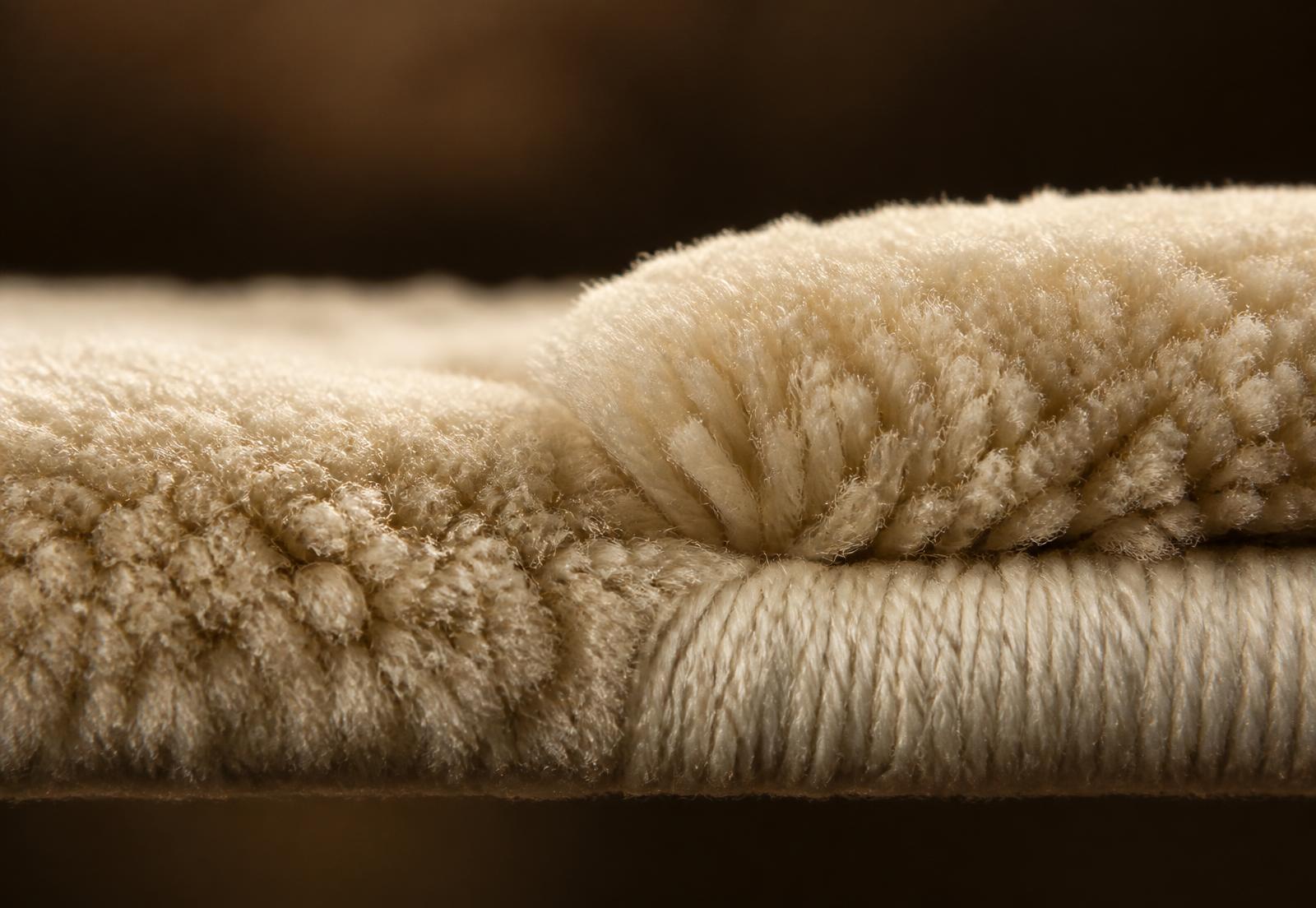 Close detail of the Egyptian Tiger wool rug construction and finished edge